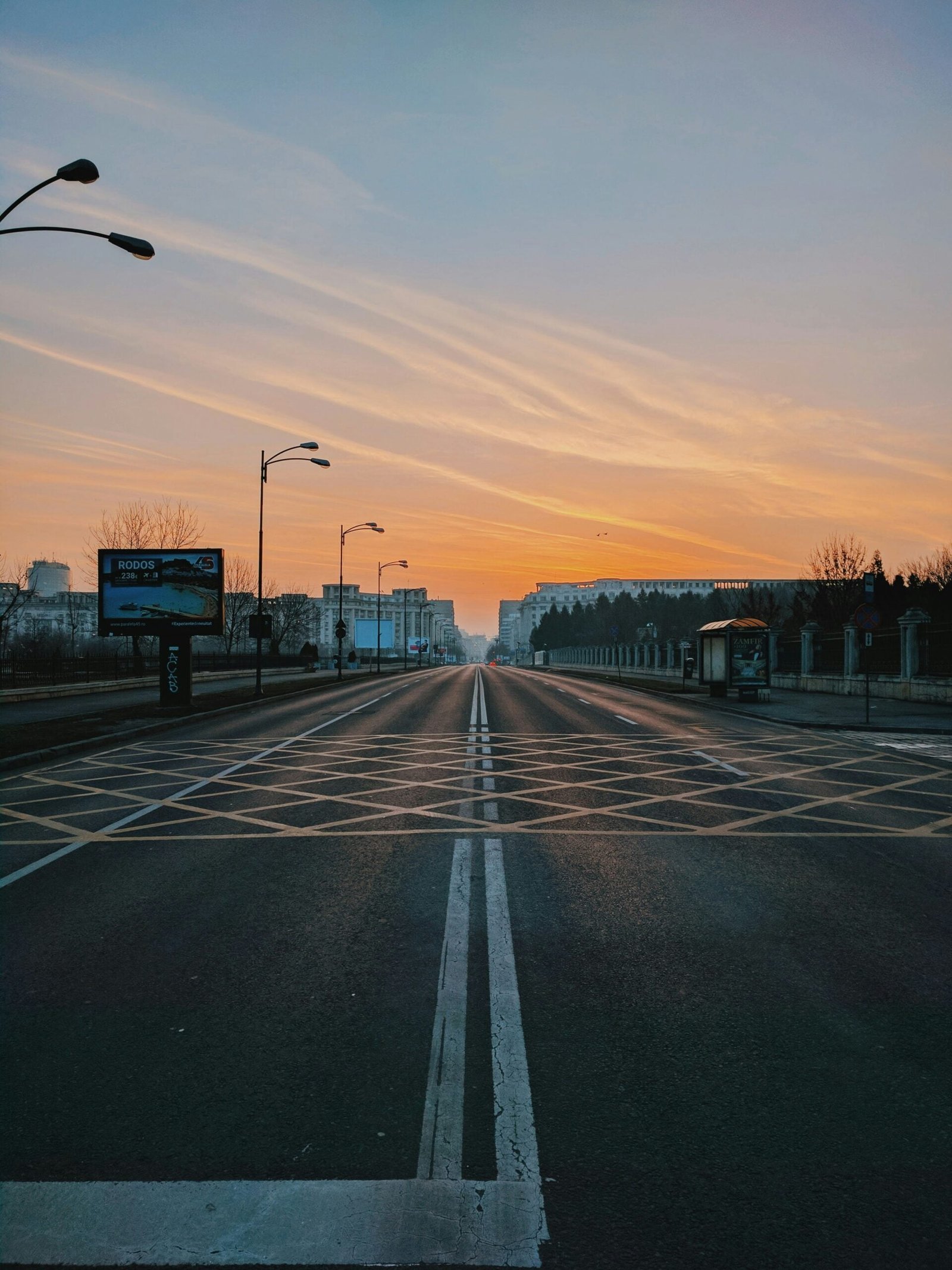 lamp post on gray concrete road